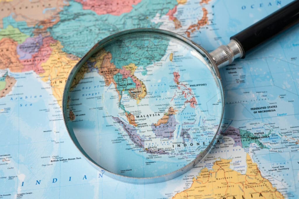 Magnifying glass focusing on the San Antonio area of a detailed road map.